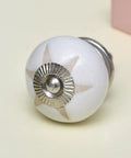 One Hundred Pieces White Ceramic Drawer Knobs With Etched Designs For Kitchen Cabinet Hardware And Dresser Door Pulls Hardy Rust Free Build Easy Peasy Install, close-up view of stylish knob.