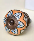 Luxury Ceramic Mustard Flower Drawer Knobs 100 Piece Set For Modern Kitchen Cabinets And Bedroom Dressers Rust Resistant close-up of orange floral knob