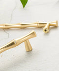 Bamboo Shape Solid Zinc Alloy Cabinet Knobs Set Of 6 In Golden Finish, showing close-up of two affordably chic handles.
