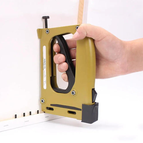 Hand using Pro Grade Point Driver For Picture Framing With 1000 Points, yellow heavy duty tool, demonstrating frame installation.