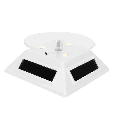 Xhtllo Electric Led Light Solar Powered Rotating Turntable Display Stand For Jewelry with clear acrylic top and solar panels.