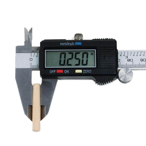 One Quarter Inch By One And A Half Inch Hardwood Dowel Pins, digital caliper measuring 0.250 inches, close-up