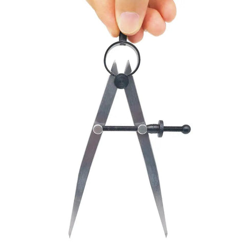 Heavy Gauge Adjustable Wing Divider Locking Steel Compass Six Inch Legs held in hand for accurate layout scribing and marking.