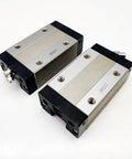 SHS20 Series Linear Carriage Block For CNC Machines And Motion Systems, Handles SHS20V SHS20VUU SS And SHS20V1UU SS, High-Precision Guide Slider For Ultra Smooth, Rock Solid Linear Motion And Easy Maintenance., two steel linear carriage blocks with mounting holes