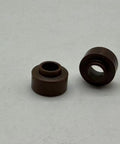 Two brown swirl rings from Pro Grade Plasma Consumables Kit For Thermal Dynamics Torch PCH 25 38 M28 M35 M40 Includes 10 Electrodes 10 Nozzle Tips 2 Swirl Rings 1 Retaining Cap For Easy Swaps And Reliable Cuts.