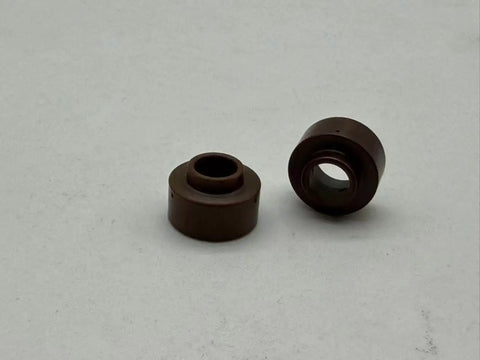 Two brown swirl rings from Pro Grade Plasma Consumables Kit For Thermal Dynamics Torch PCH 25 38 M28 M35 M40 Includes 10 Electrodes 10 Nozzle Tips 2 Swirl Rings 1 Retaining Cap For Easy Swaps And Reliable Cuts.