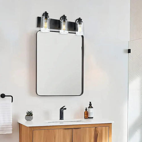 Three Head Vintage Bath Vanity Light Fixture In Matte Black With Clear Glass Shades Over Mirror Wall Mount Bathroom Lighting