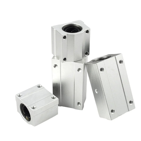 Three Mssoomm SCS10UU aluminum linear motion bearing blocks with mounting holes and visible bore (front view).