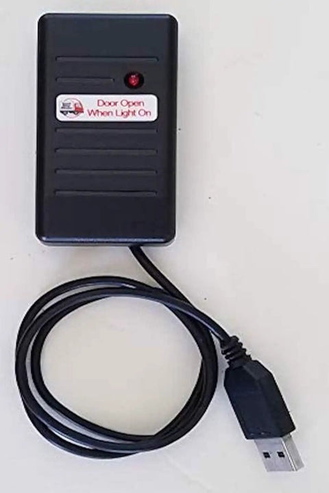 Big Rig Cargo Door Alert And Roll Up Opener Security Monitor With Straight Plug 12 Volt Power and Dual USB Charging Ports showing black device with a light.