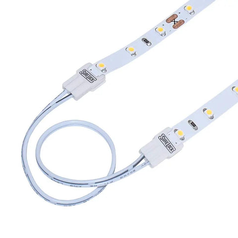SureLock 560724 White LED Tape Light Wire Lead Connector 5 Pack connected to 8mm wide LED strip showing two-wire connection.