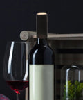 A wine bottle sealed with Wine Heat Shrink Capsules Set 100 Pieces With PVC Bottle Sealing Film Disposable Shrink Wrap Caps In Black for freshness.