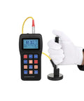 Top Shelf Digital Hardness Tester Portable Handheld Metal Gauge displaying steel hardness readings in use with calibration block.