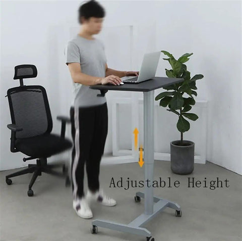 Smooth Roll Mobile Standing Desk With Height Adjustable Pneumatic Lift Sleek Black Aluminum Frame Ergonomic Rolling Workstation in use with laptop.