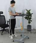 Pro Grade Aluminum Alloy Mobile Standing Desk Offering Hella Smooth Stepless Height Adjustment And Ridiculously Stable Wheeled Base For Your Next Level Workstation Flex in use with laptop.