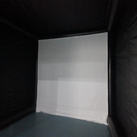 Interior view of Inflatable Portable Golf Simulator Tent With Curtain For Indoor Practice Swing, black PVC, no projector, large space visible.