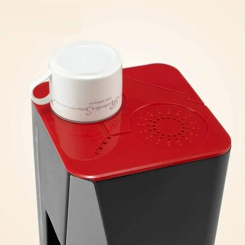 Top Shelf Automatic Espresso Maker Crushing Your Morning Grind While Pouring Killer Lattes Or Chilled Cold Brew Sips Around The House With Easy Drip Coffee And Tea Capabilities, with a white cup on red top.