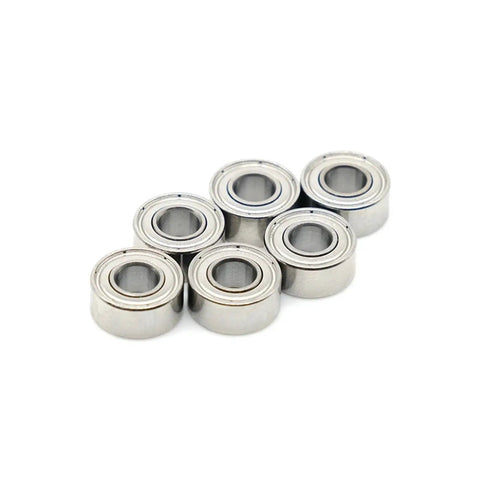 Super Cool Set Of 10 Tiny 2x6x3mm Mini Ball Bearings Made From Super Durable Chrome Steel arranged in a group.