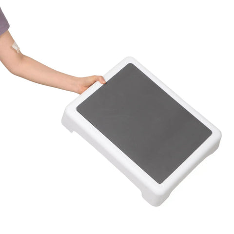 Person holding Portable Puppy Training Platform with non-skid surface for indoor and outdoor dog agility practice.