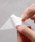 Premium White PVC Adhesive Collar Stays 240 Pack Shirt Collar protectors being peeled off for application on shirts.