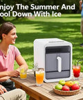 Compact Countertop Nugget Ice Maker Slaps Out Fresh Ice In Ten Minutes With Zero Sweat Self Cleaning System And Slick Storage Basket Built For Everyday Home Office Rv Or Game Day Hangouts in outdoor setting with beverages.