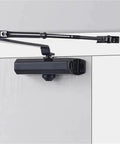 Beefy Hydraulic Door Closer 25Kg To 80Kg, Adjustable Speed, shown mounted on door, durable steel build, anti slam feature.