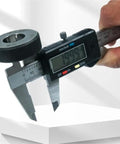 YMGSCC Caliper for Jewelry Metal Measurement measuring a circular metal piece with digital readout display