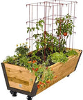 Wooden planter box with tomato plants and marigolds on heavy duty caster wheels, featuring red wire supports.