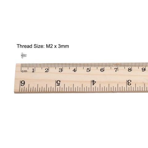 Heavy Duty M2x3mm Phillips Machine Screws Slick Nickel Plated Carbon Steel Fasteners With 3.8mm Heads, shown with ruler for size reference.