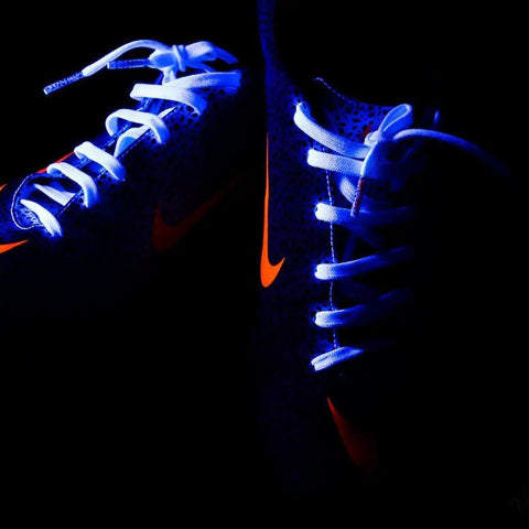 Glowing sneakers illuminated by 180W UV LED Par Light With DMX Control, Pro Blacklight Strobe And Wash Fixture For glow parties.