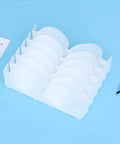 Six Piece Clear Plastic Bra Storage Box With Dividers For Wardrobe Closet Drawer Organization To Keep Lingerie Lineup Hella Neat And Shielded From Deformation A Straight Up Must Have Staple on a blue background.