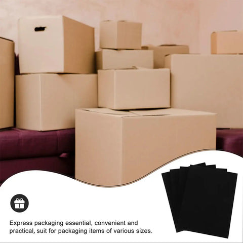 4 Pack Black Hard Foam Blocks 405x305x25mm Shipping Padding Sheets next to stacked cardboard boxes
