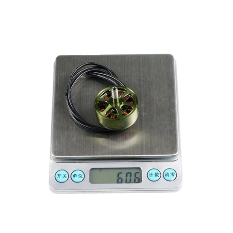 1100KV Brushless Drone Motor For 3 To 6S LiPo Pack on scale showing 60.6 grams