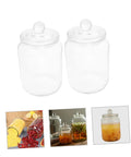 Level Up Your Pantry Setup With These Hella Tough 2 Liter Airtight Glass Tea Canisters And Food Storage Jar Set, two clear jars with lids.
