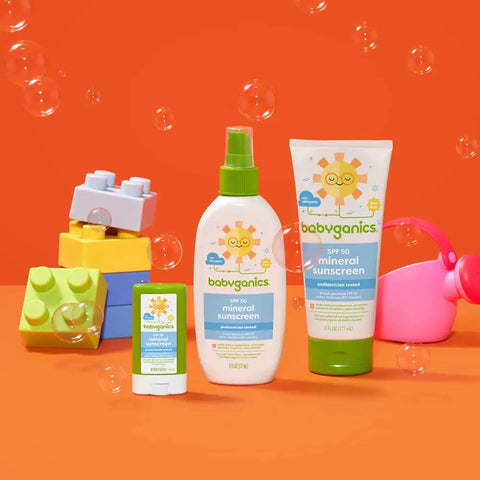 Mineral SPF 50 Kids Sunscreen Lotion With Zinc Oxide And Titanium Dioxide Broad Spectrum UVA UVB bottles among toys