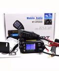 KT-8900D Dual Band Mini Car Radio Transceiver With USB, showing LCD display, cables, and microphone in packaging.