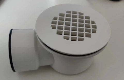 Low Profile Shower Base Drain With Perforated Strainer 1.5 Inch Side Outlet PVC Drain For Trap And Drain Assembly displayed