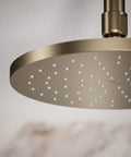 8 Inch Round Rain Showerhead With 2.5 Gpm Drenching Spray, Vibrant Brushed Bronze Finish, Katalyst Spray Technology close-up view