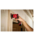 12 Volt Brushless Cordless Orbital Detail Sander Featuring Variable Speed Trigger And Integrated Led Light For No Sweat Sanding On Tight Edges Lightweight Powerhouse in use on wood trim.