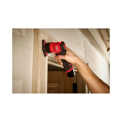 12 Volt Brushless Cordless Orbital Detail Sander Featuring Variable Speed Trigger And Integrated Led Light For No Sweat Sanding On Tight Edges Lightweight Powerhouse in use on wood trim.