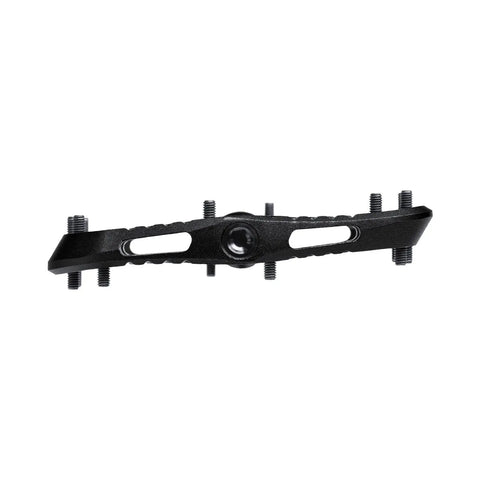 Side view of Wave Pedals Black With Convex Front And Concave Back showing unique convex-concave design and pedal spikes for grip.
