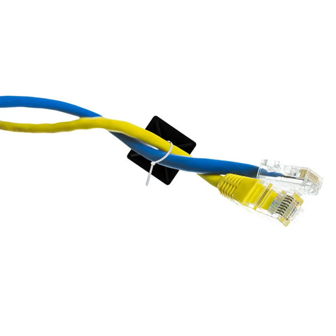 Two Ethernet cables secured with a black self-adhesive cable clip, part of 100 Pack Self Adhesive Cable Clips Heavy Duty Black Plastic Cord Management Brackets Peel And Stick Wire Ties Tame Your Wire Clutter And Keep Pc Usb Cords Tangle Free.