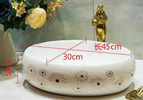 Slick Ceramic Oval Vessel Sink For Modern Bathroom Counters Smooth Glazed Finish with flower design, dimensions 45cm x 30cm x 14cm.
