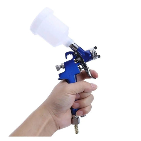 Premium Mini Paint Sprayer With Slick Adjustment Knobs And Hassle Free Setup For Rapid Car Detailing And Smooth As Glass Coatings, lightweight airbrush in hand.