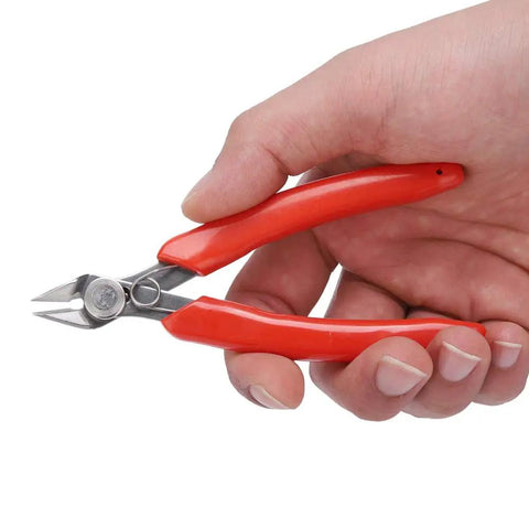 Person holding 107F1 Electronic Diagonal Pliers With High Carbon Steel Cutting Nippers Ergonomic Handle Portable Hand Tool close-up.