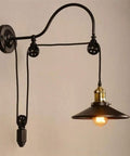 Adjustable Pulley Wall Sconce With Clear Glass Lampshade Straight Up Industrial Rustic Single Head Ceiling Light E27 Bulb Ready Fixture For Bar And Cozy Home Vibes, featuring black metal and brass details.
