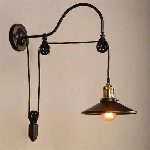 Adjustable Pulley Wall Sconce With Clear Glass Lampshade Straight Up Industrial Rustic Single Head Ceiling Light E27 Bulb Ready Fixture For Bar And Cozy Home Vibes, featuring black metal and brass details.
