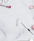 Premium Packove 8 Pcs Stainless Steel R Cotter Pins on a marble surface with beauty tools, designed for heavy duty use.