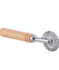 Pastry wheel cutter with wooden handle and fluted metal wheel, side view for dough and pastry cutting