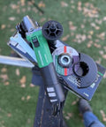 Powerful 4-1/2 Inch Angle Grinder With 12 Amp AC Brushless Motor, Variable Speed, shown with disc, on green background