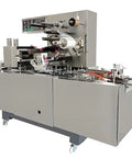 Heavy Gauge Stainless Steel Automatic Box Overwrap Sealer With Precision Cellophane Film Sealing No Sweat Setup For Top Tier Food Beverage Production Lines Today, side view showing machine components.